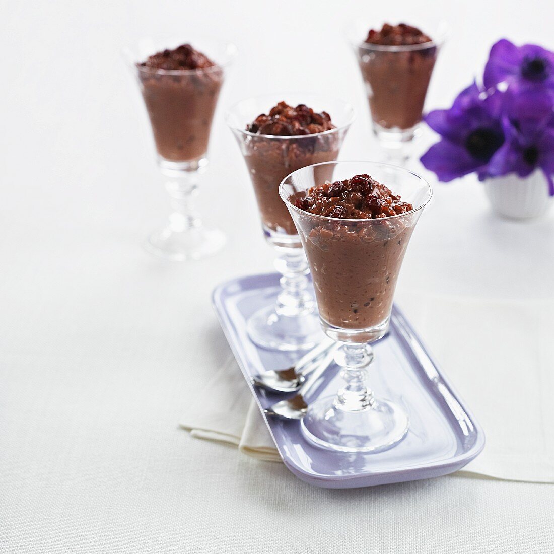 Four glasses of chocolate pudding