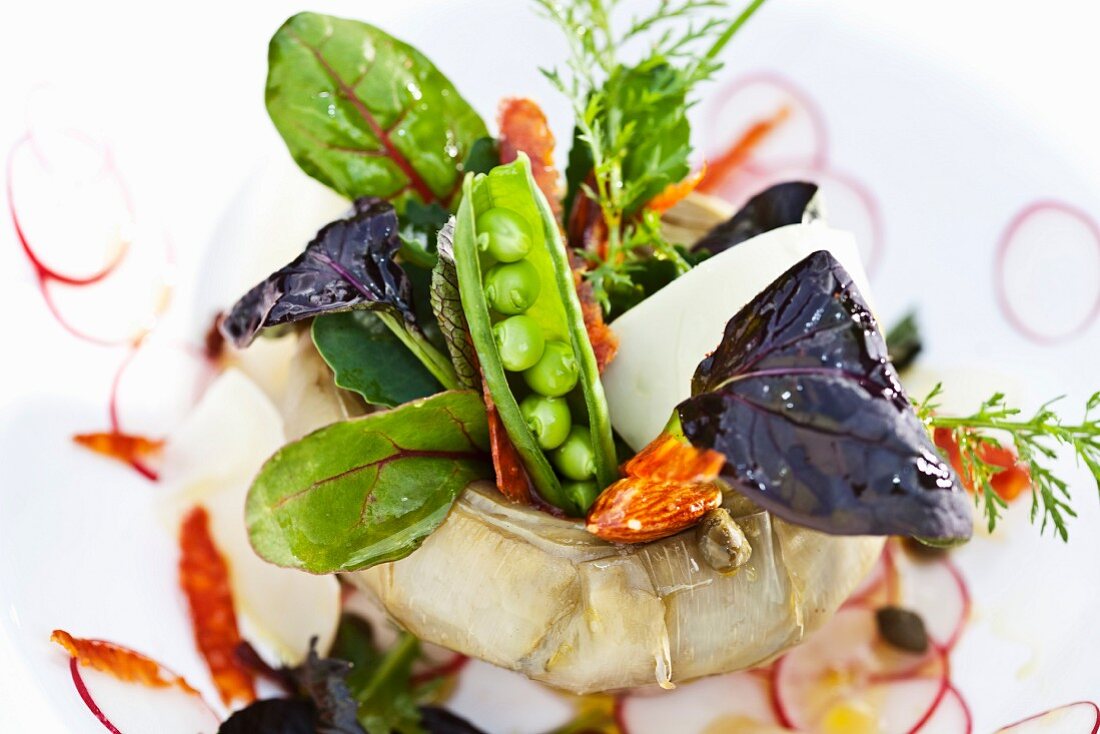 An artichoke heart filled with a small vegetable salad