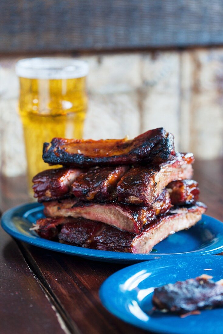Grilled pork ribs and a glass of beer in a pub