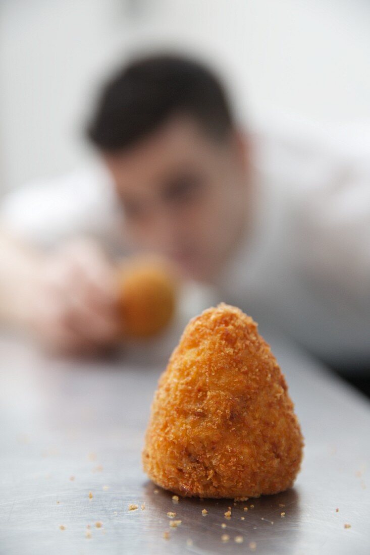 A chef with arancini