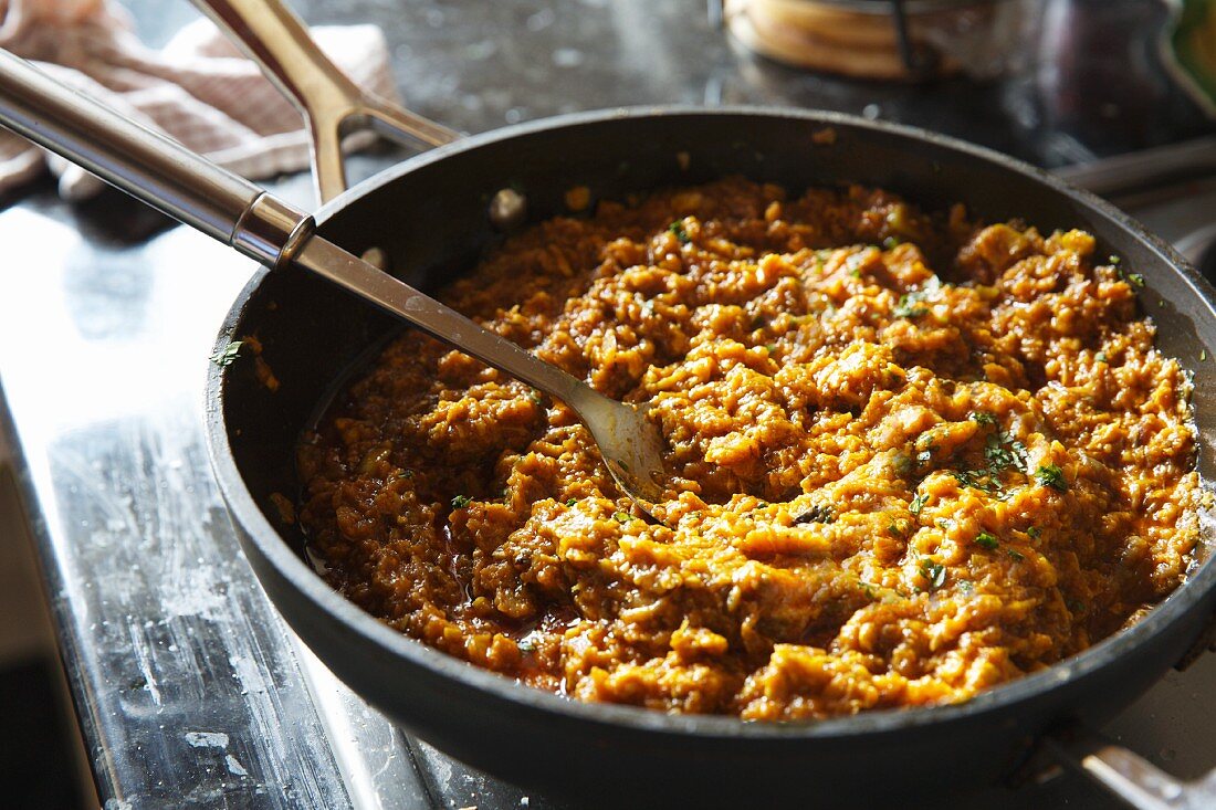 Fried aubergine dip in a pan