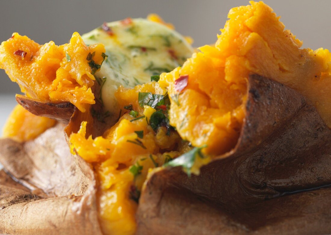 Baked sweet potatoes with herb butter