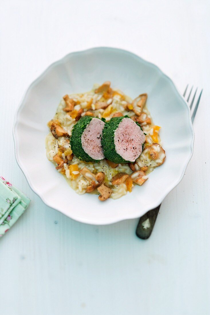 Veal fillet in a herb coating on chanterelle mushroom risotto