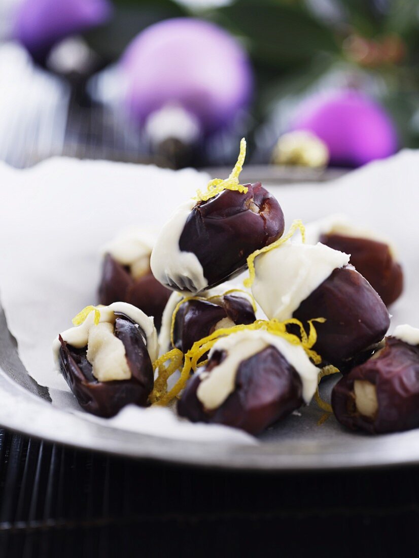 Stuffed dates dipped in white chocolate for Christmas