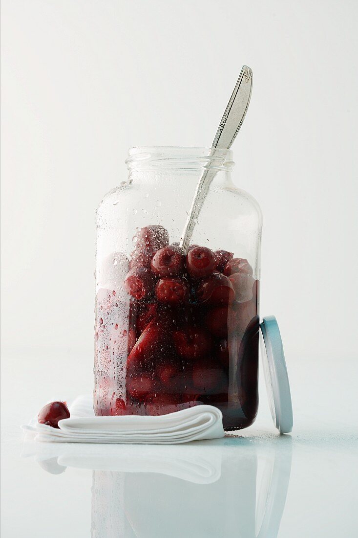 Preserved cherries in a screw-top jar