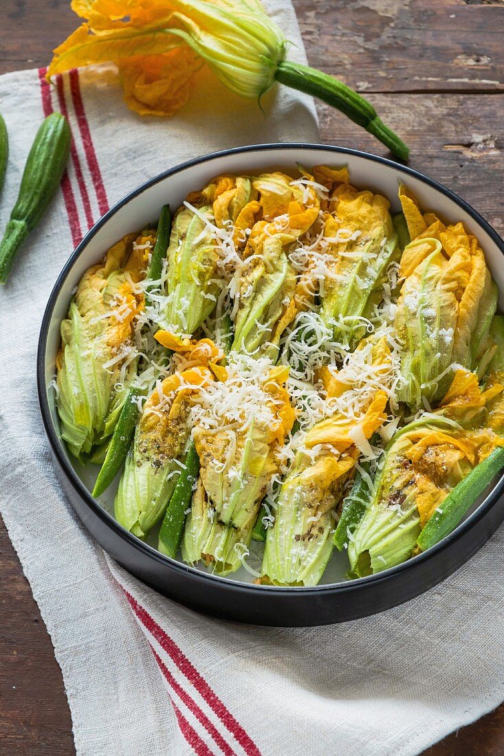 Stuffed courgette flowers in a baking dish