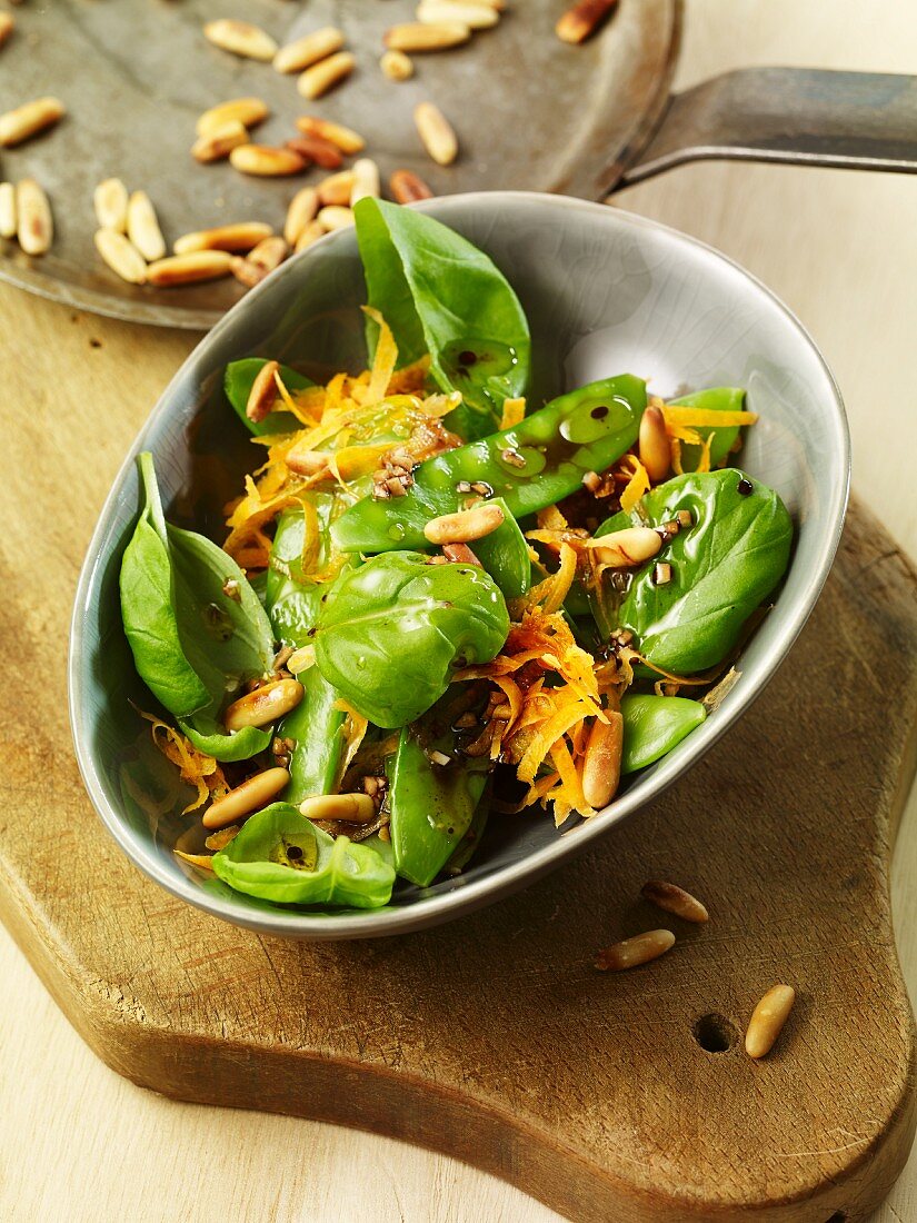 Mange tout salad with basil and pine nuts