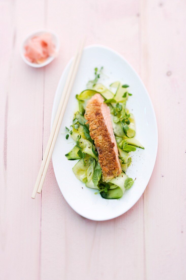 Salmon steak on a cucumber salad