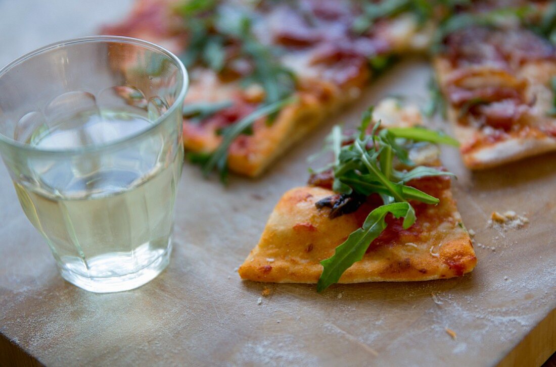 Ham and rocket pizza, sliced