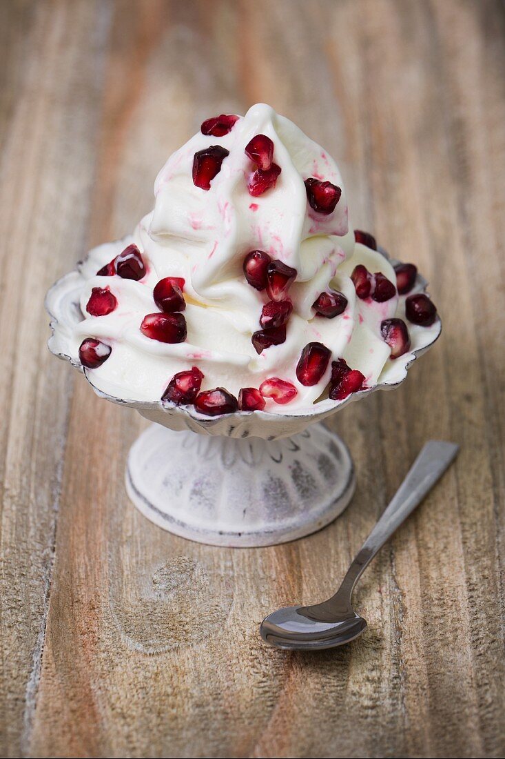 Frozen yogurt with pomegranate seeds