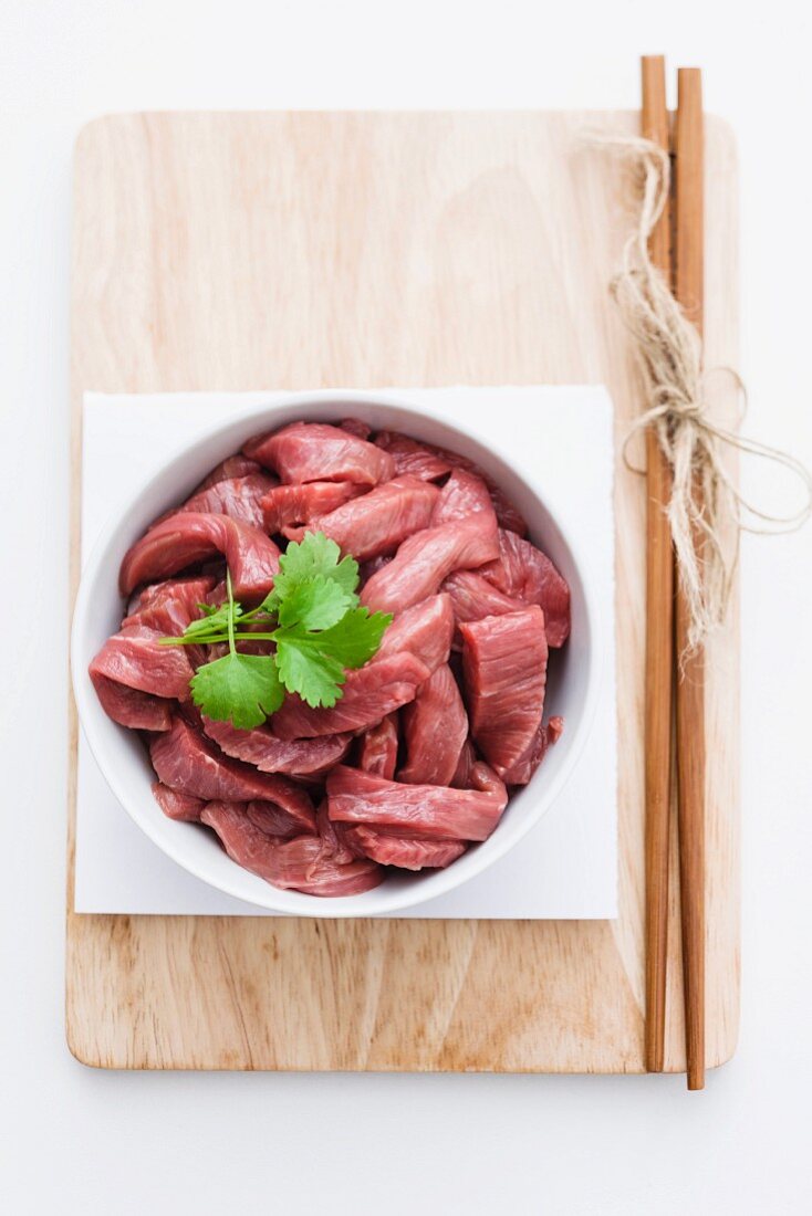 Leg of lamb cut up for a stir fry