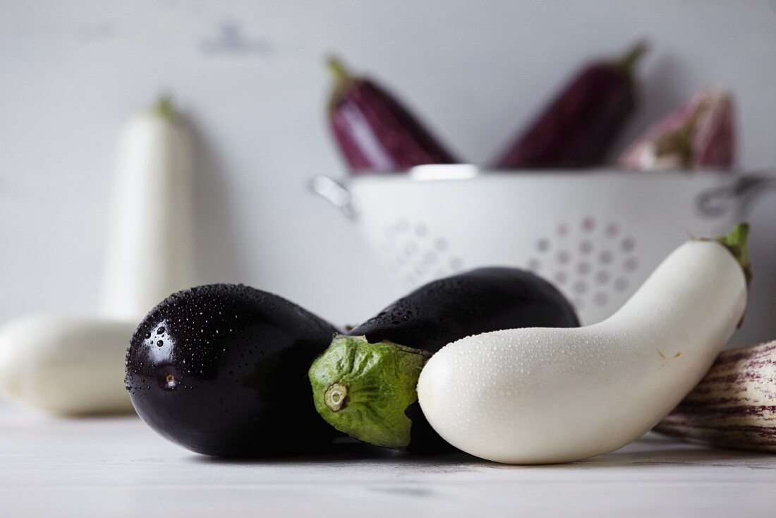 White and purple aubergines in a kitchen