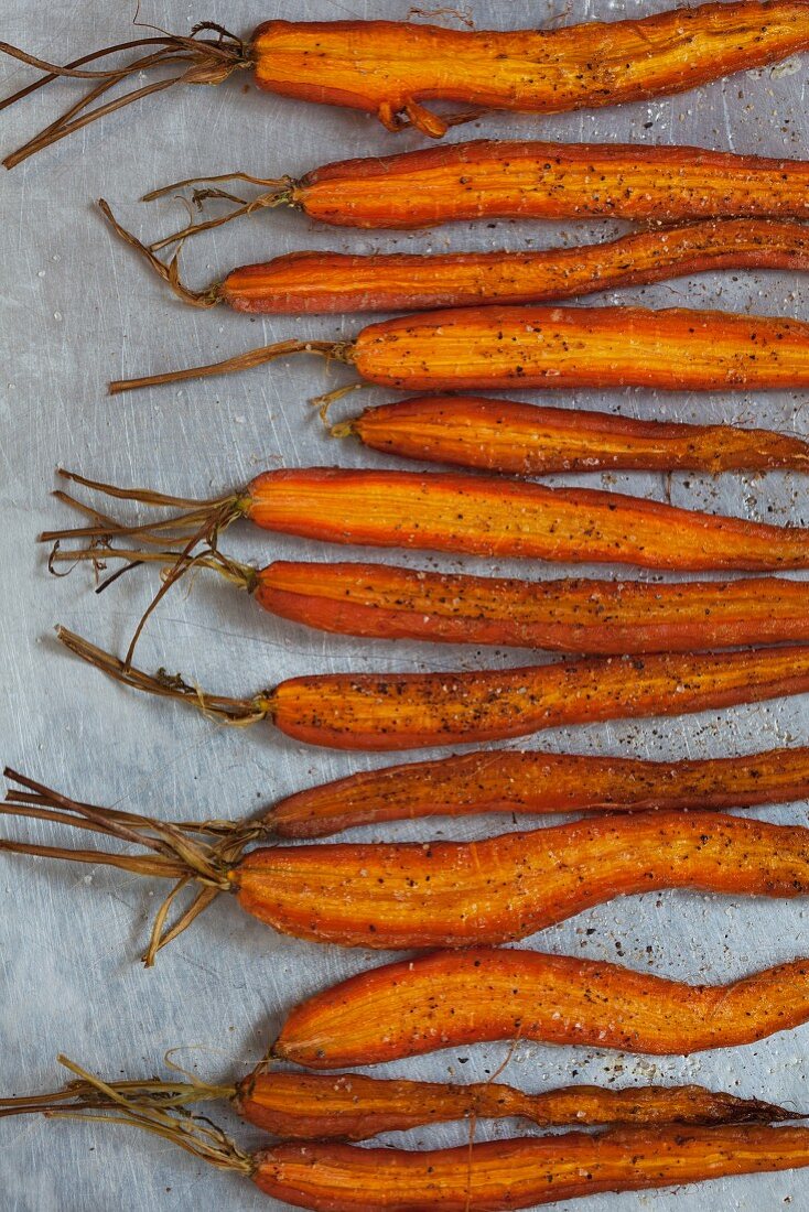 Halved roasted baby carrots with salt and pepper