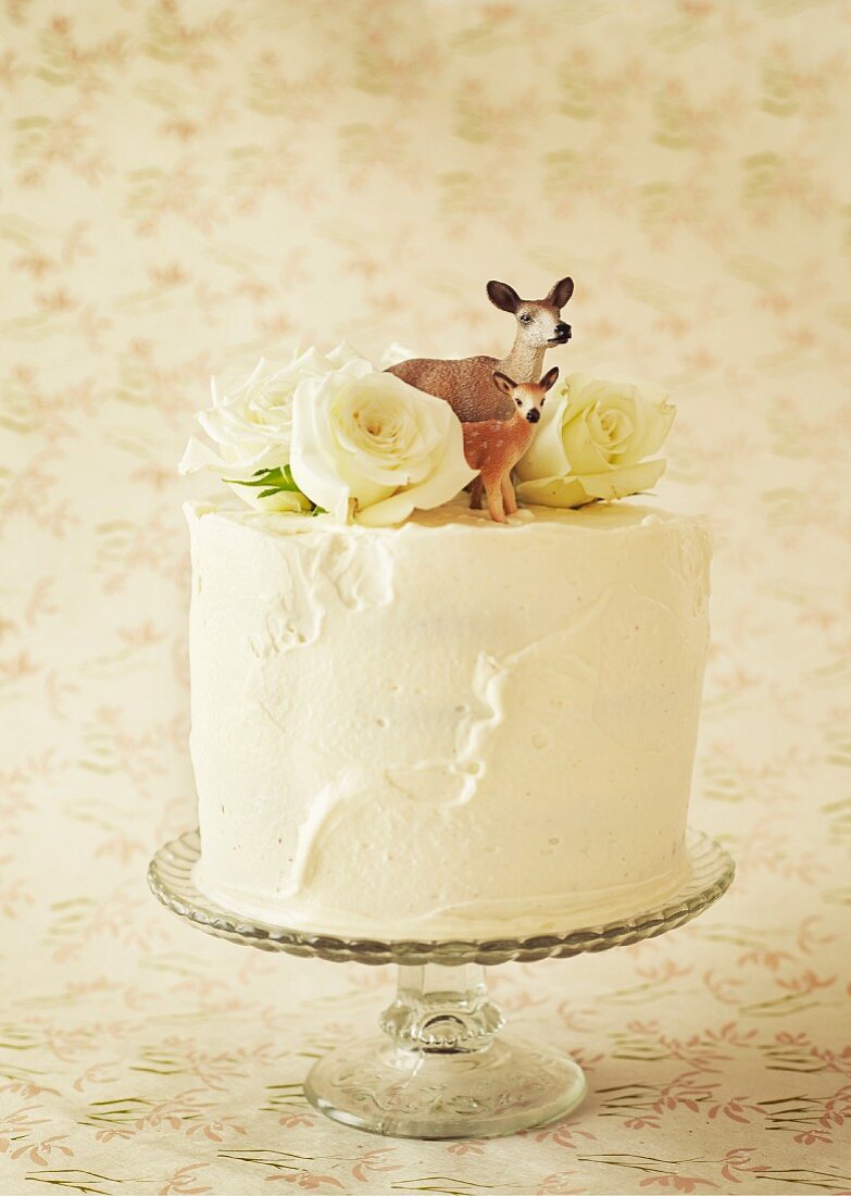 Carrot cake with cream cheese decorated with a deer figure