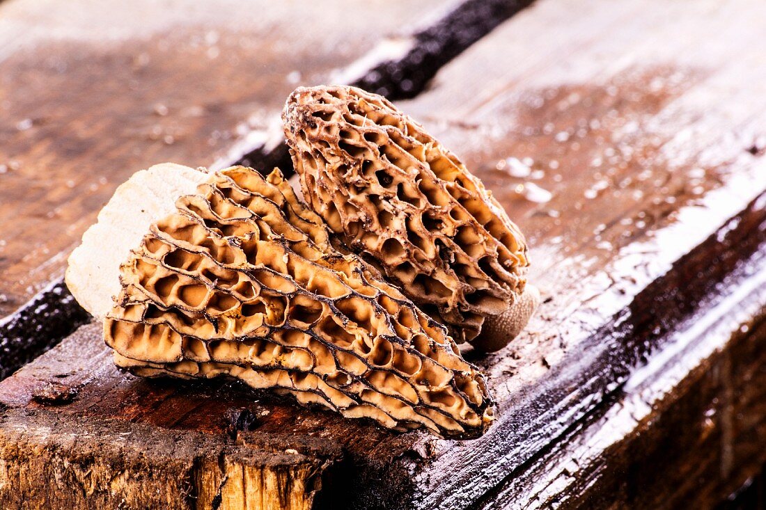 Fresh morel mushrooms on a wooden crate