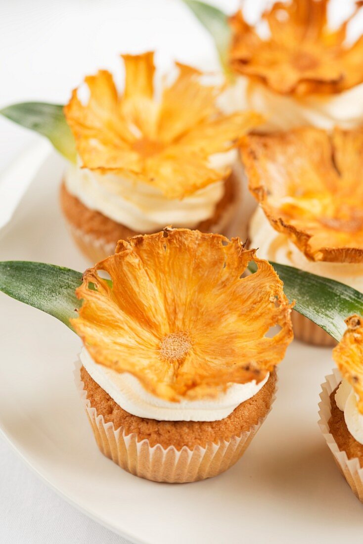 Cupcakes decorated with dried pineapple chips