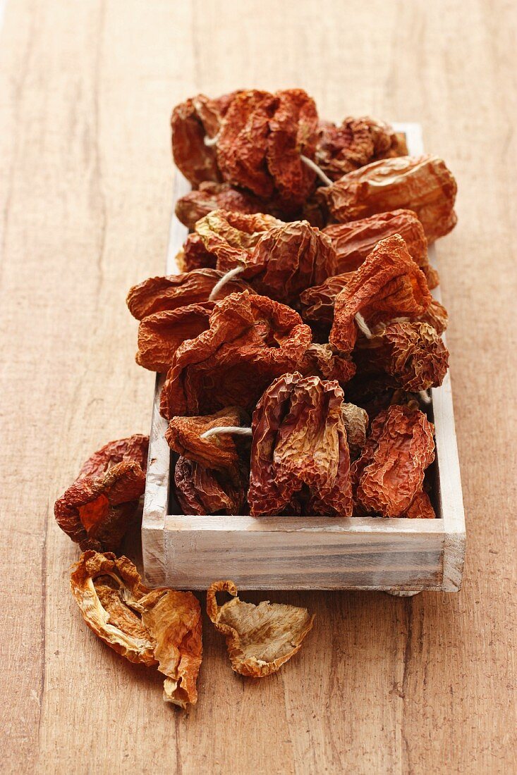 Dried peppers in a wooden box