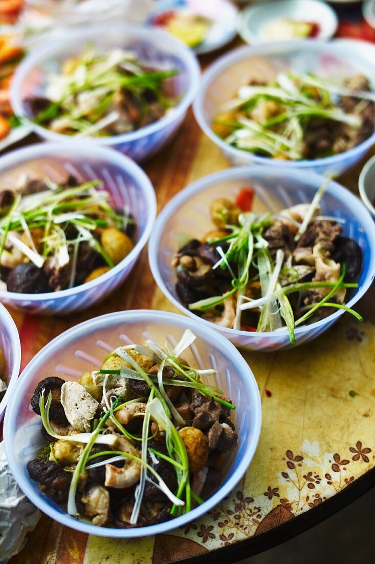 Vietnamese mushroom salads in plastic bowls