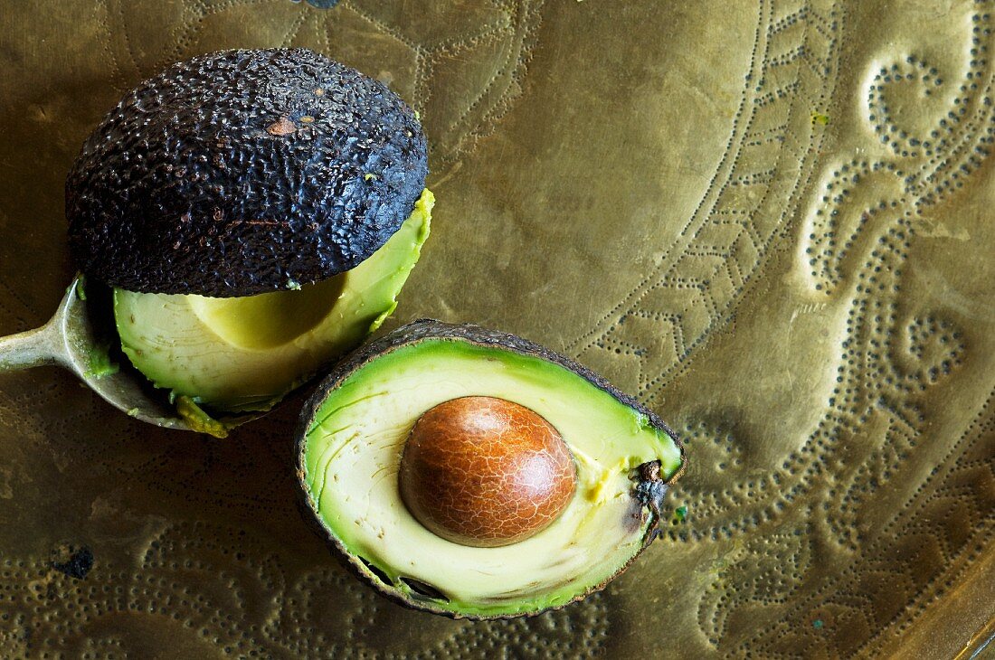 A halved avocado with stone