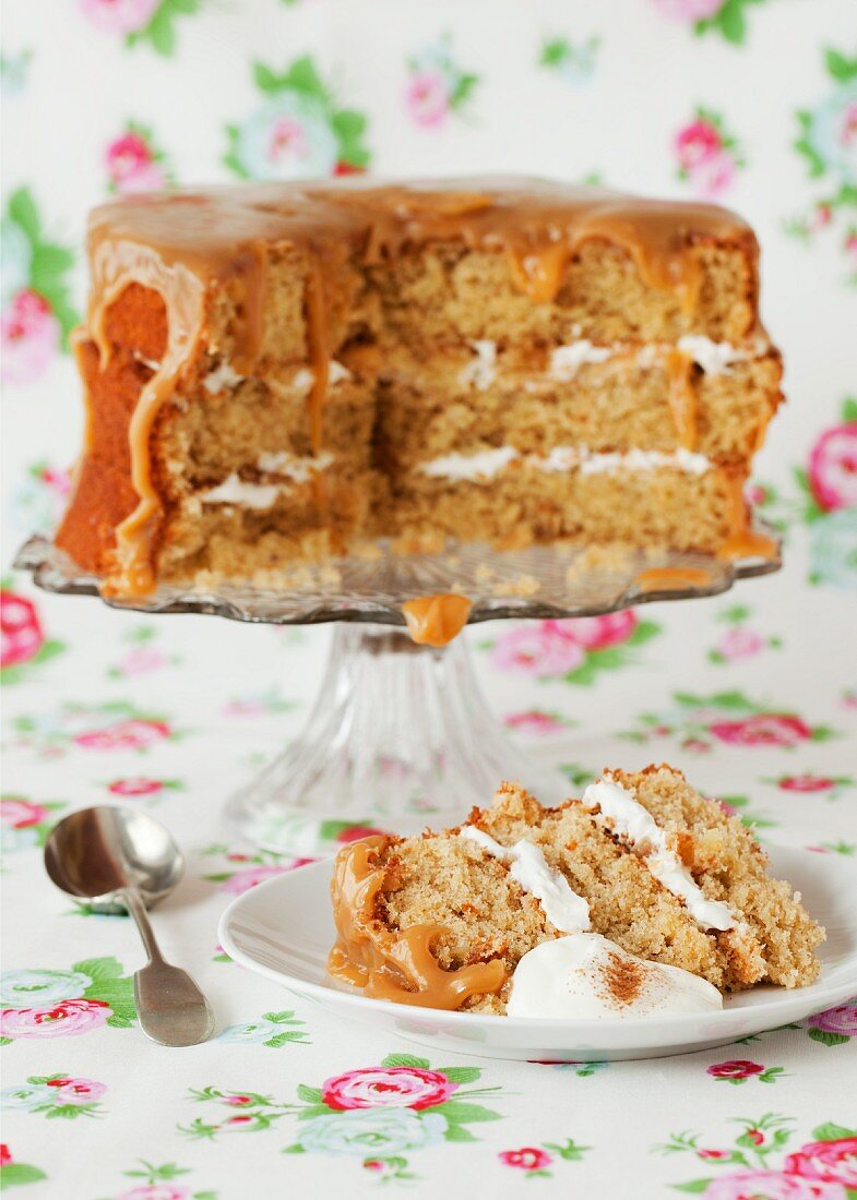 Apple and cinnamon sponge cake with a caramel glaze, sliced