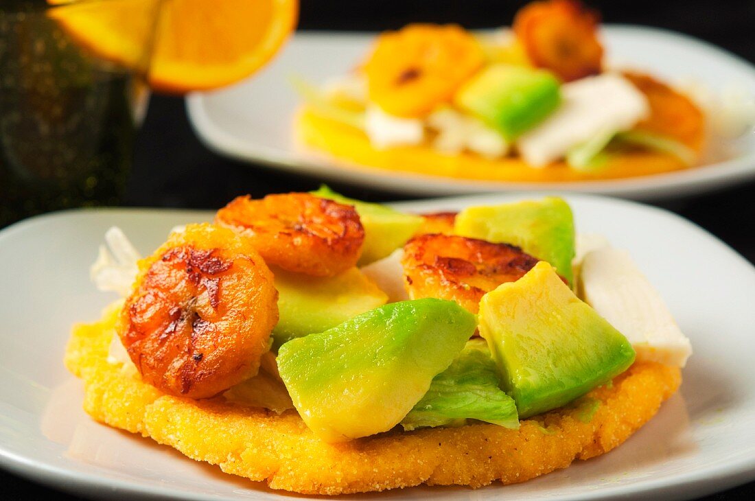 Arepas with avocado, cheese, plantains and lettuce