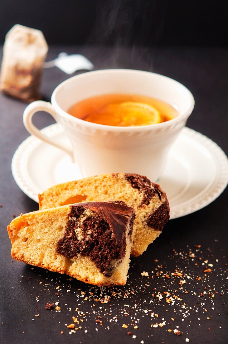 Marble cake and a cup of tea with lemon