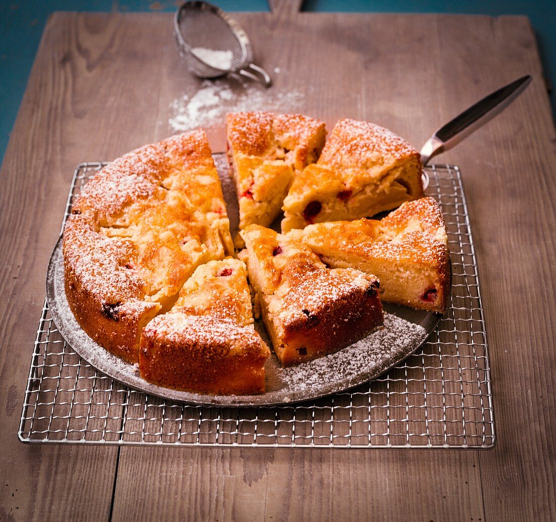 Polish apple and gooseberry cake dusted with icing sugar