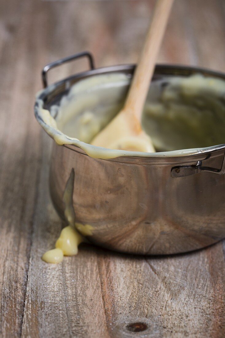 Remains of homemade vanilla pudding in a pan