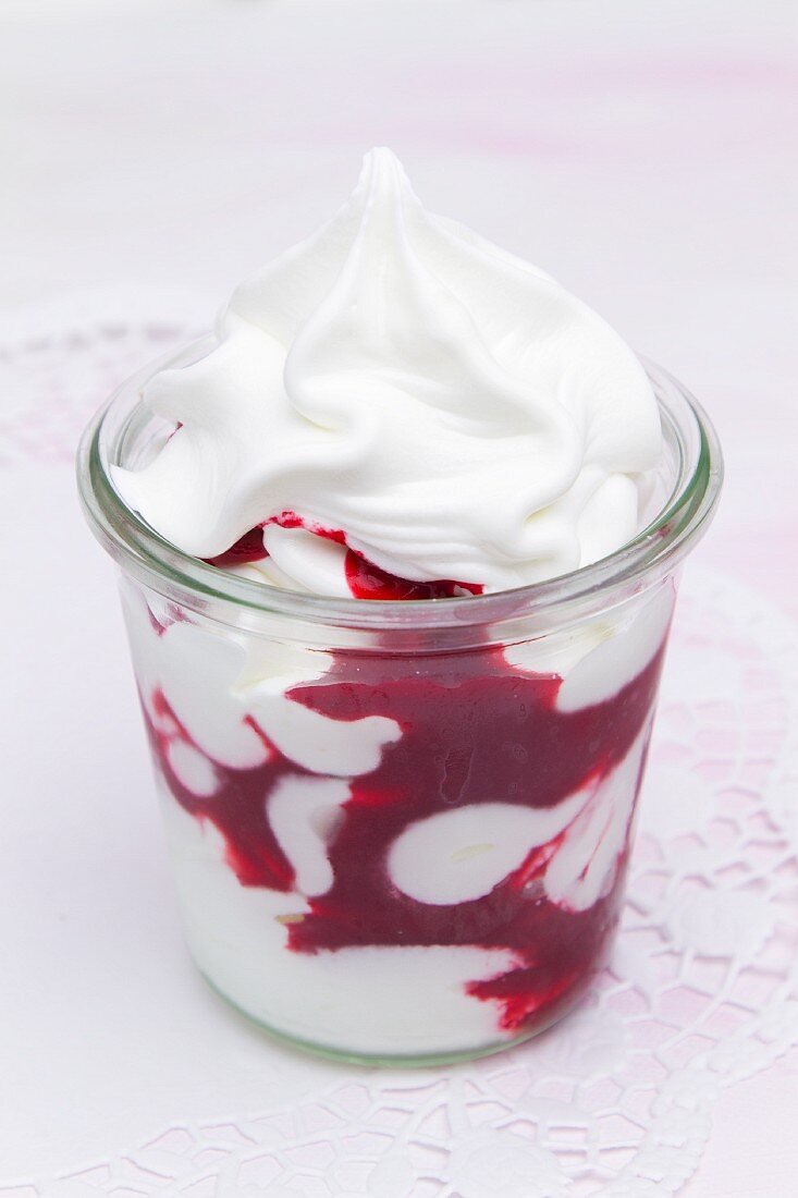 Creamy yogurt with raspberry sauce