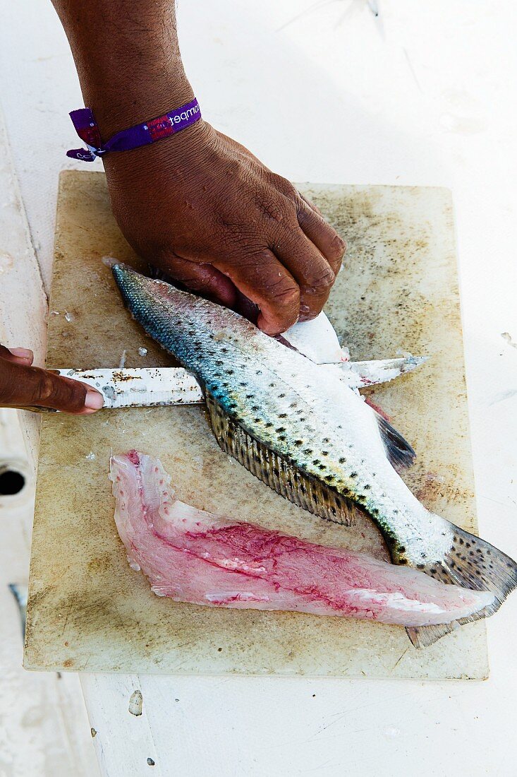 Ceviche being made: fish being filleted