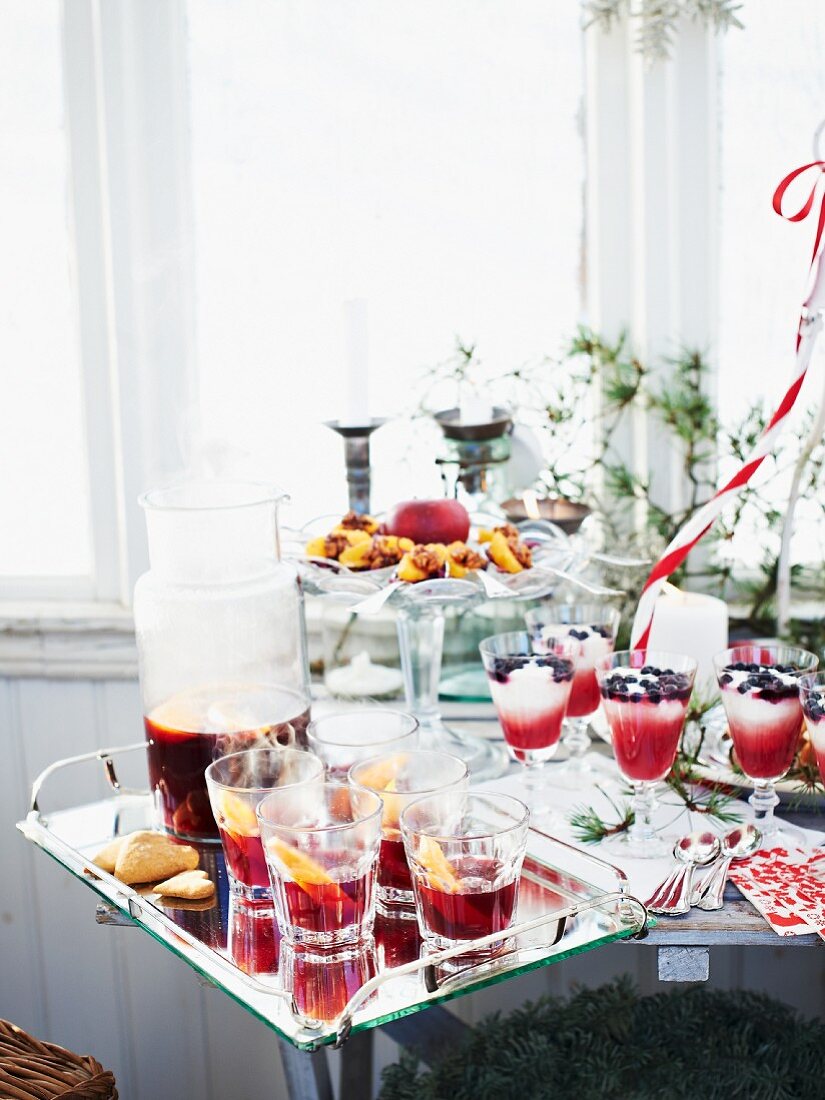 A Christmas buffet with drinks and desserts