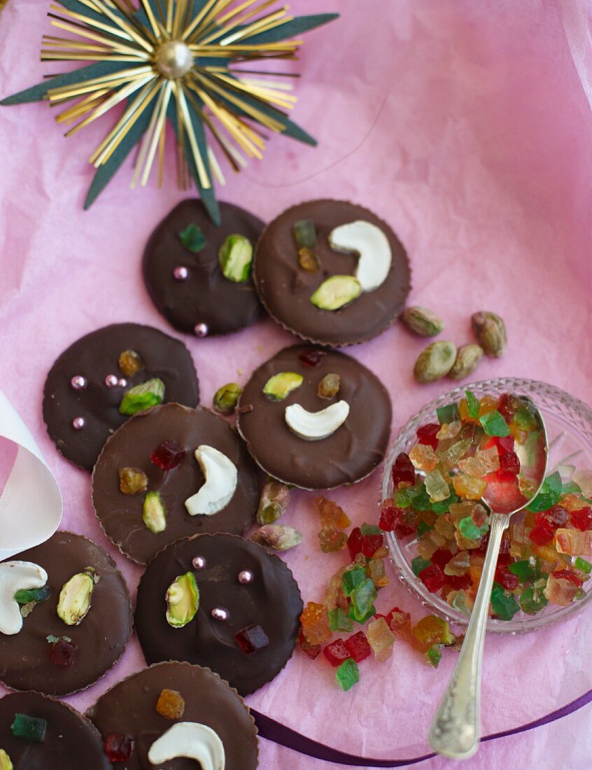 Milk and dark chocolates with nuts, candied fruits and sugar pearls