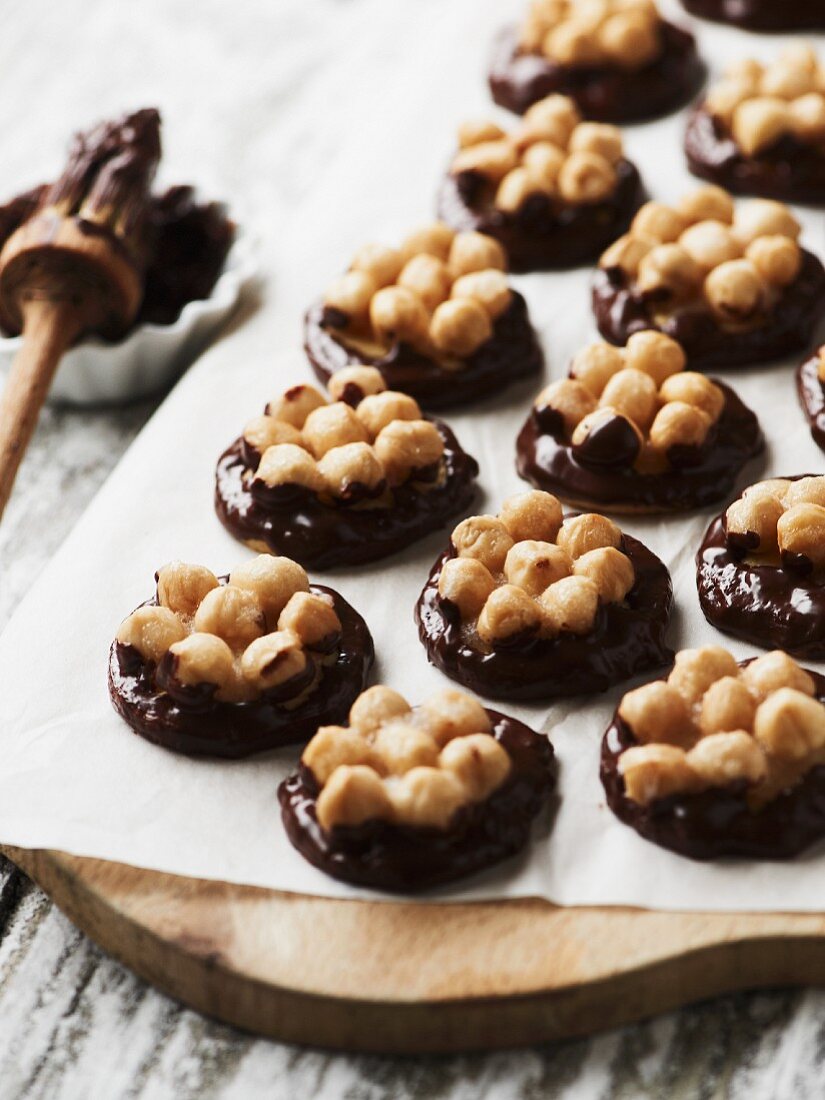 Nut biscuits with dark chocolate on a piece of paper