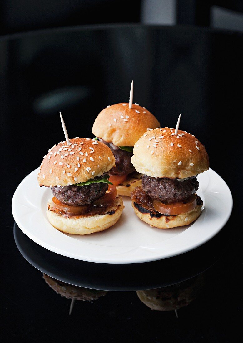 Mini hamburgers held together with toothpicks