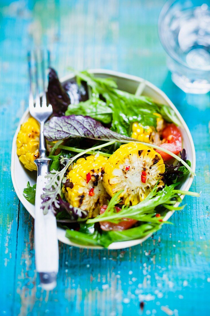 Wild herb salad with grilled corn on the cob