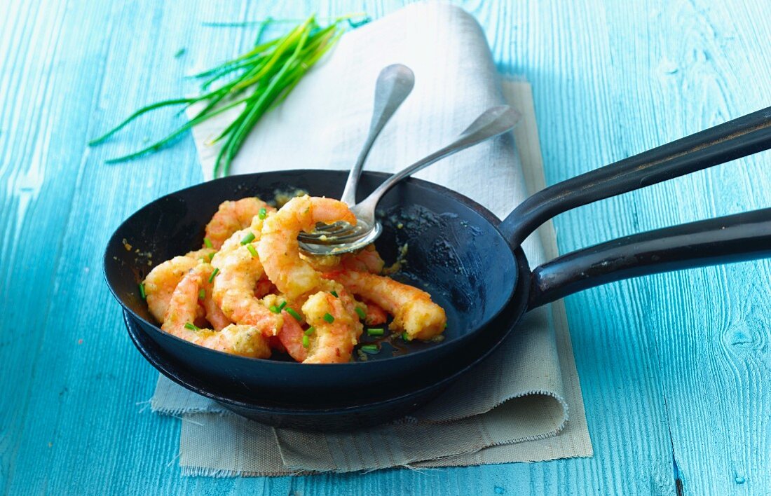 Prawns with herbs and chilli in a pan
