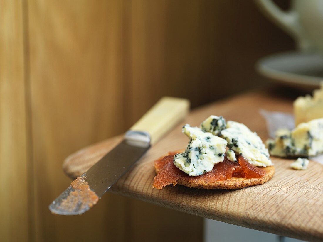 A slice of bread topped with Stilton and quince jelly