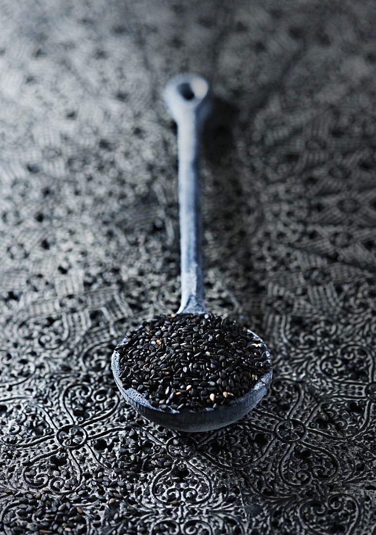 Black sesame seeds on a spoon