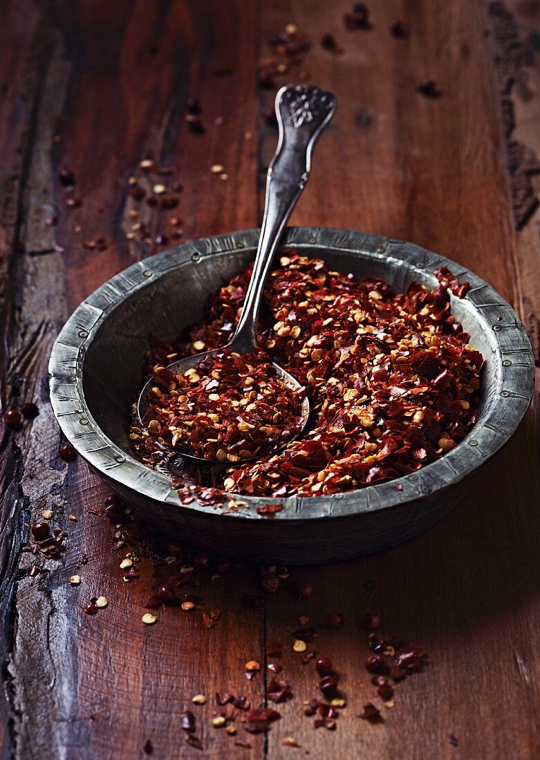 Dried chili flakes in a rustic dish