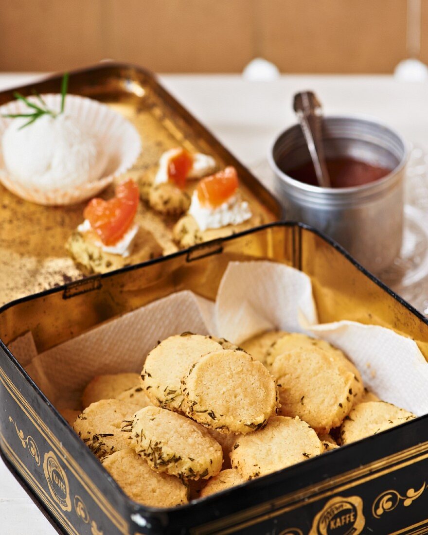 Parmesan biscuits with rosemary in a biscuit tin