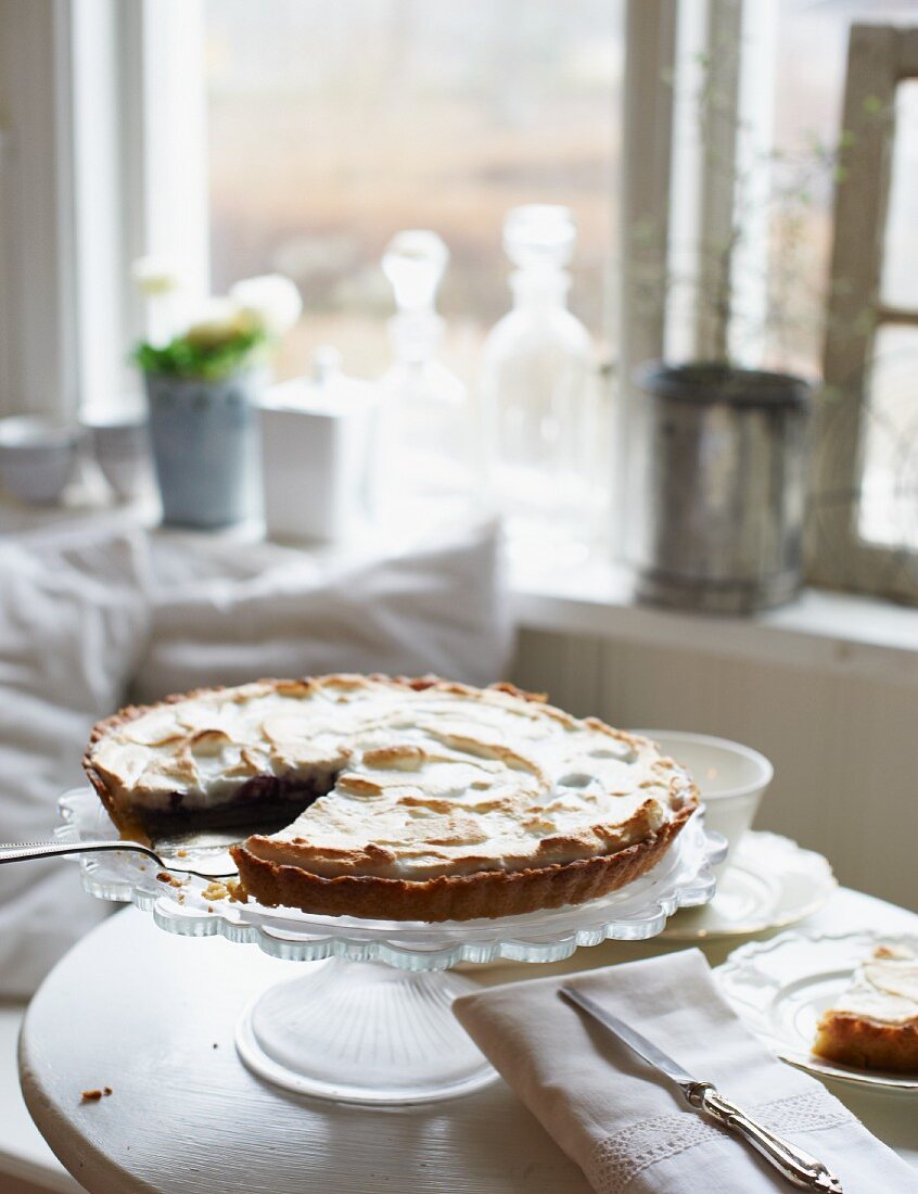 Bilberry and passion fruit meringue pie