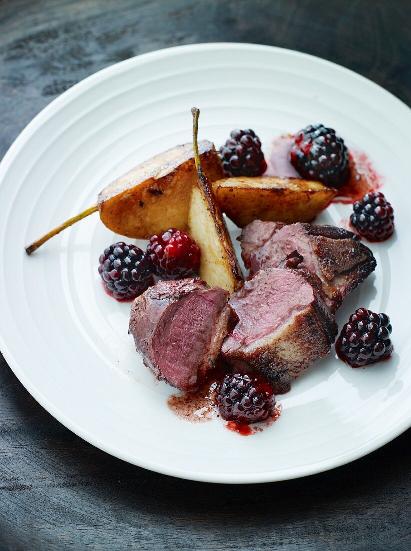 Wild duck breast with blackberries and pears