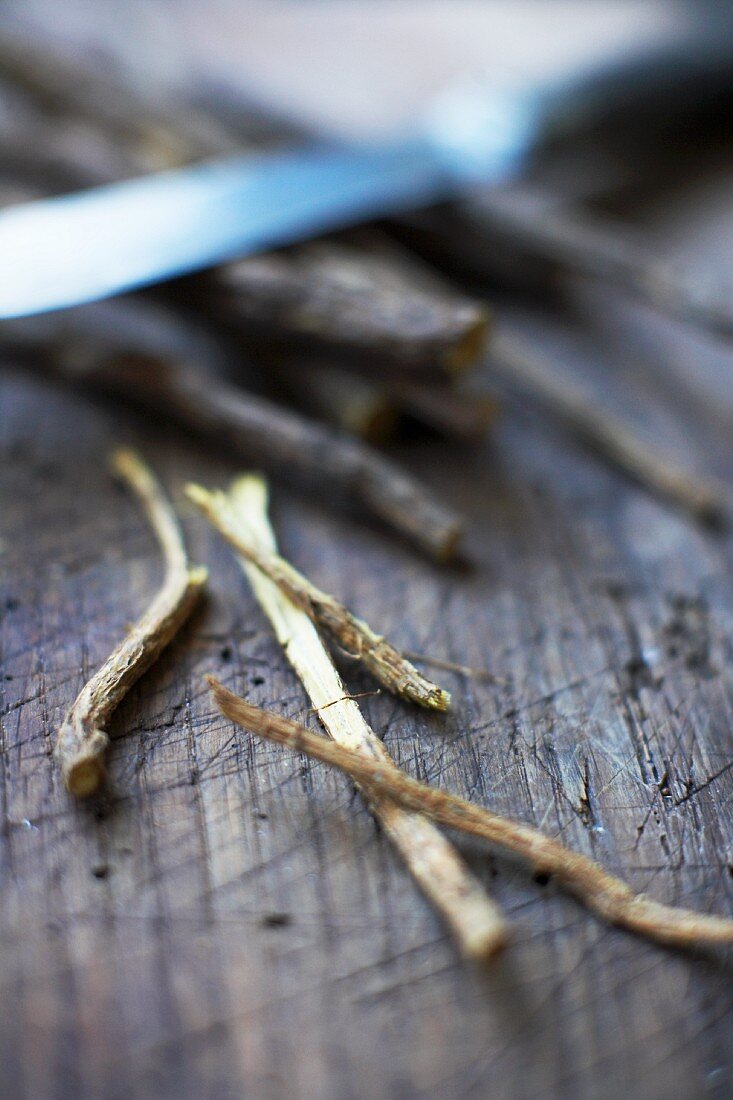 Liquorice sticks on a wooden background