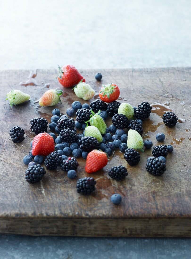 Fresh summer berries on a chopping board
