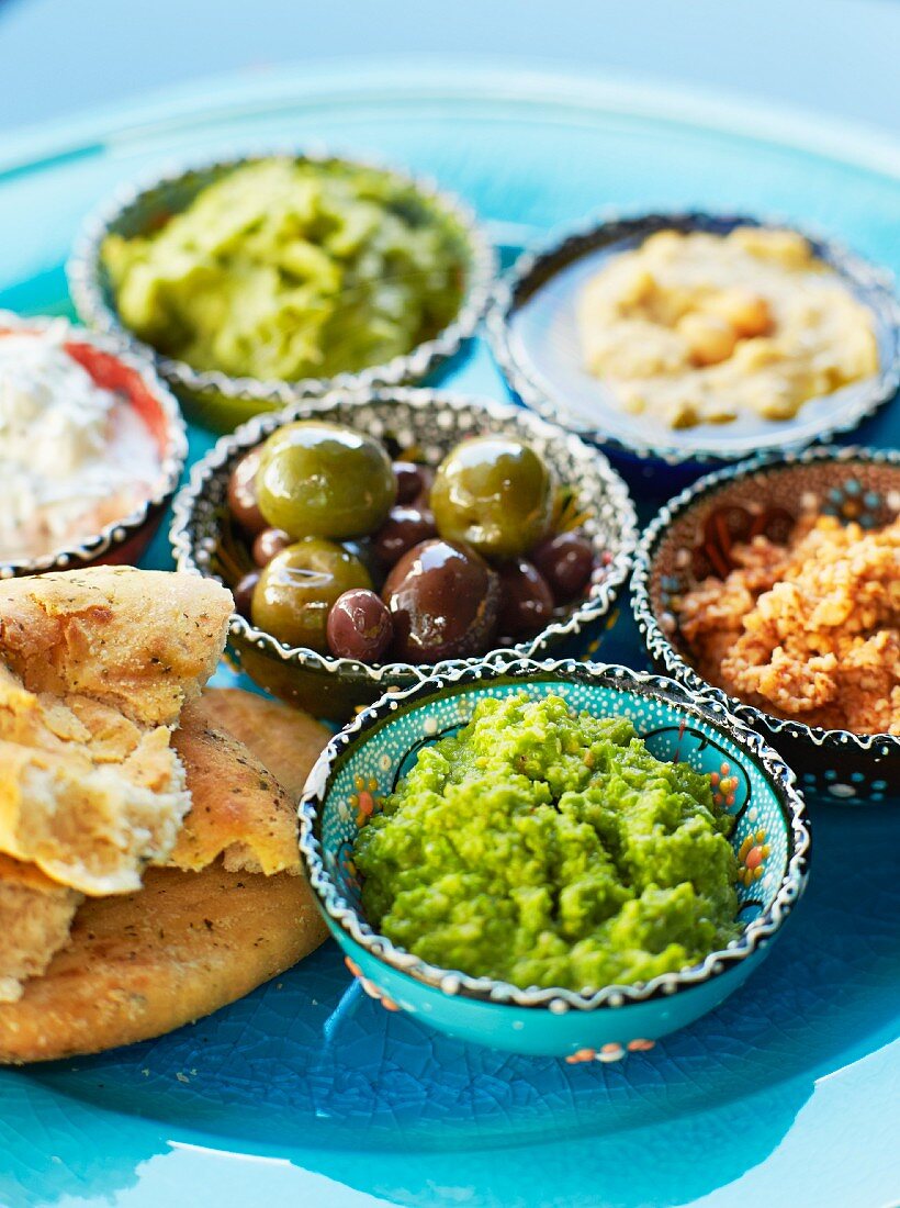 Dips: almond cream, hummus, olive tapenade, avocado cream, pea puree, raita