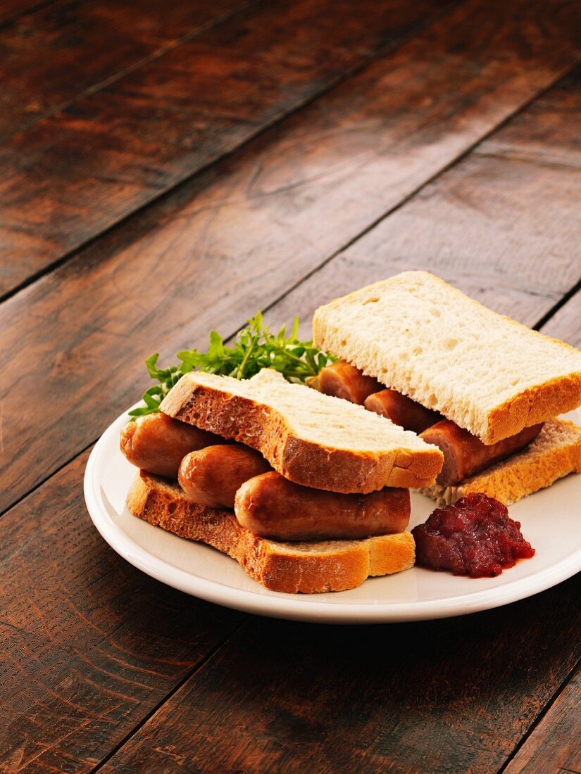 A sausage sandwich with salsa