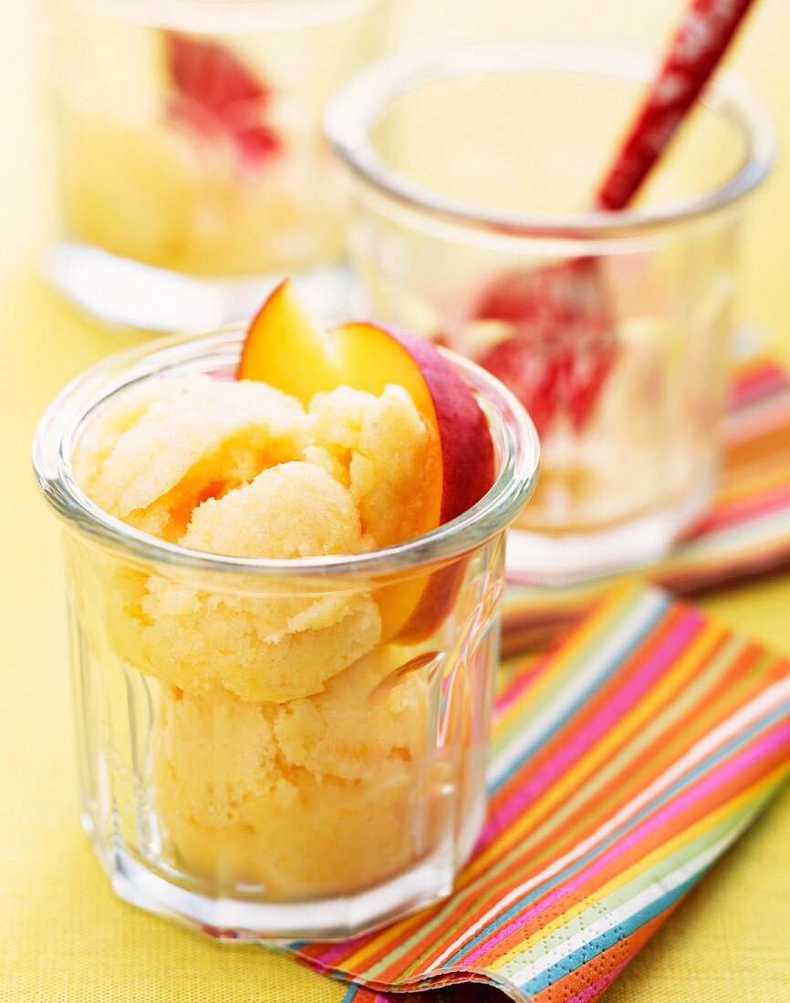 Peach sorbet garnished with peach slices