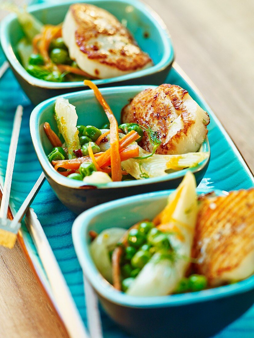 Grilled scallops on vegetables