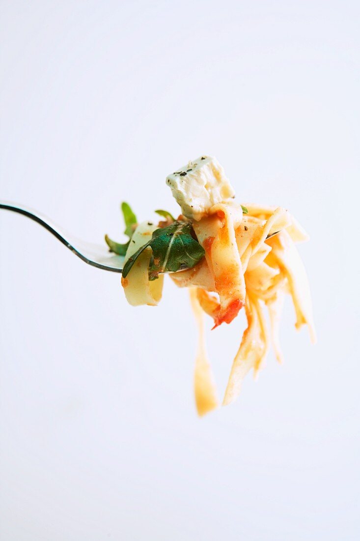 Tagliatelle with tuna and feta on a fork