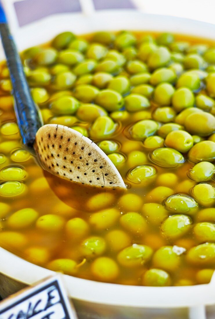 Preserved green olives at a market